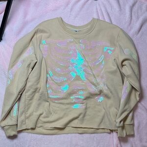 Queen Of Sparkles Cream Sweatshirt with Iridescent Skeleton Design